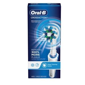 Cross action electric toothbrush with charging station NEW!!